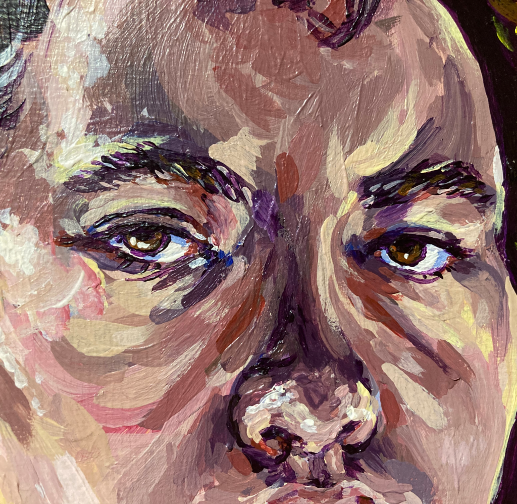 a close-up of a painting of a face